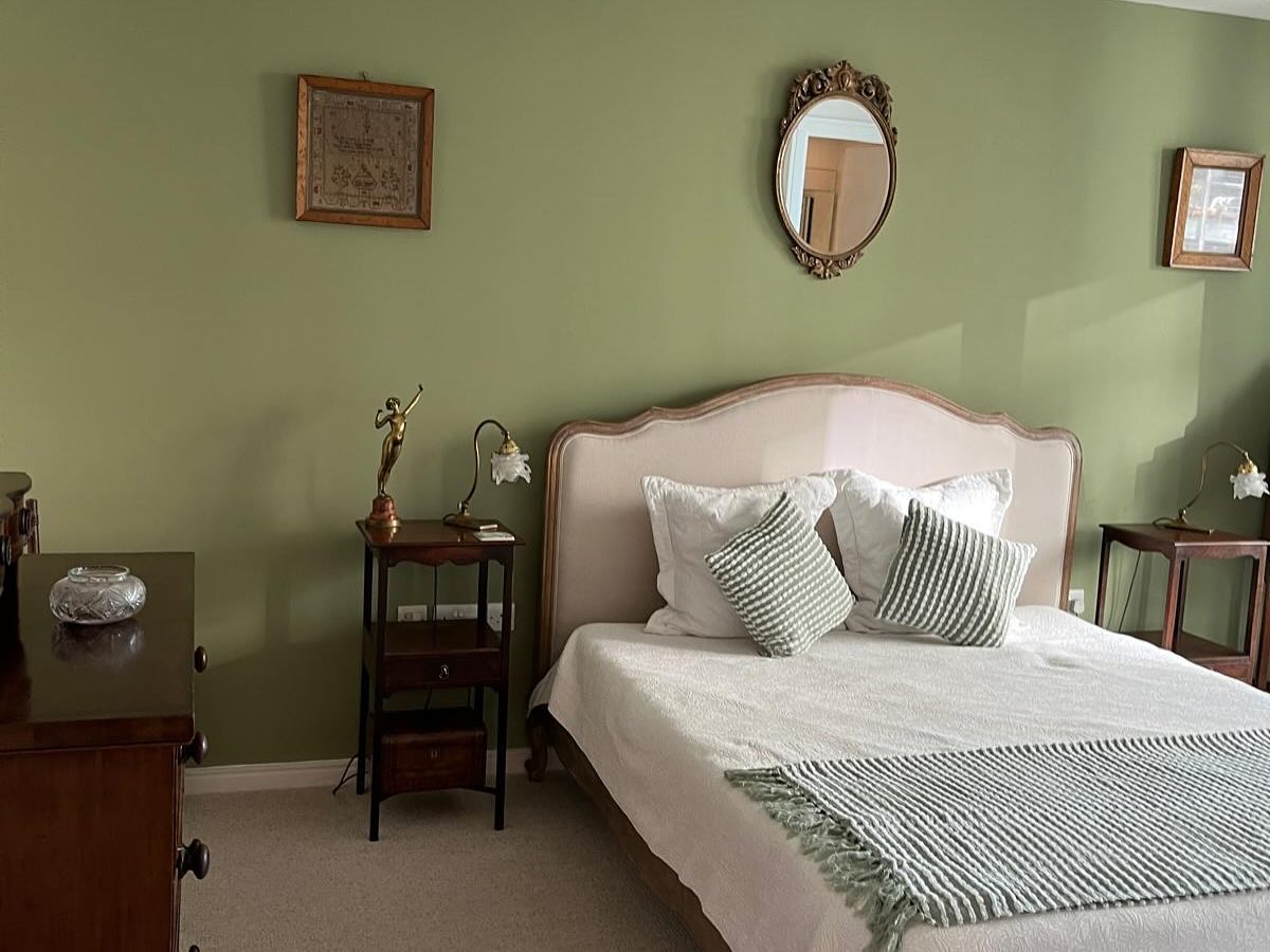 Bedroom decorated in a soft green by Gold's Property Solutions.