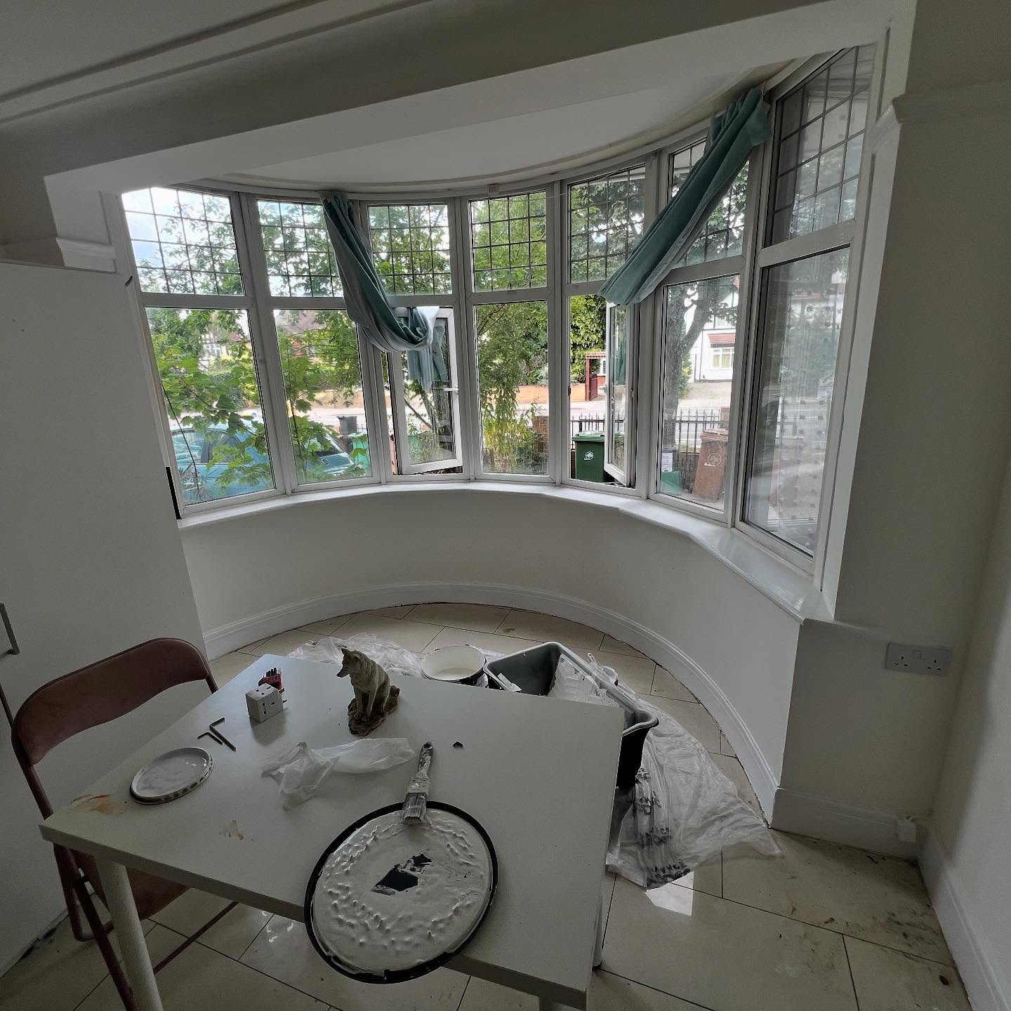 Bay window recess restored and decorated in a clean, crisp white.